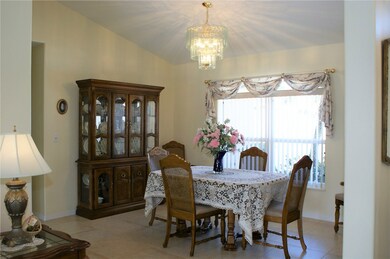 Formal dining area with custom draperies.