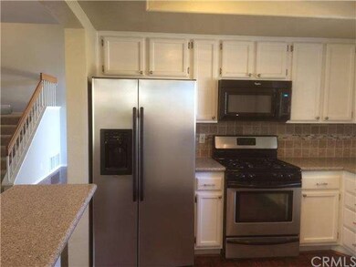 Kitchen with granite counters and stainless steel 