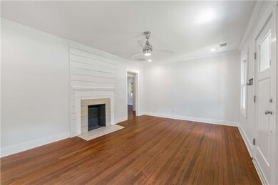 Spacious living room with decorative fireplace