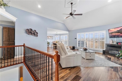 Living room offers large window and open flow to t