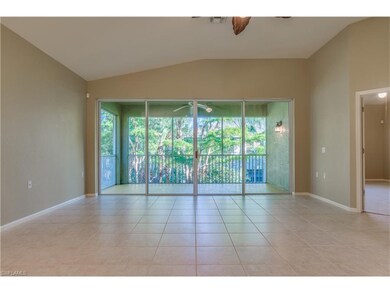 Living room opens to lanai overlooking the preserv