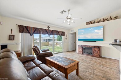 Living room with light wood finished floors, visib