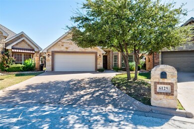 View of front of home featuring the 2 car garage.
