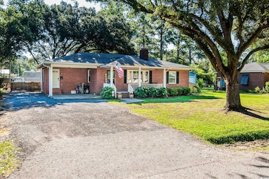 Ranch-style house featuring covered porch and a fr