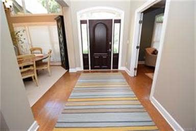 Spacious foyer boast high ceilings and leads into 