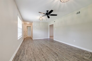 LIVING ROOM W/VIEW OF FOYER
