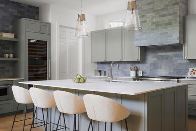 Kitchen with beverage cooler, gray cabinets, deco