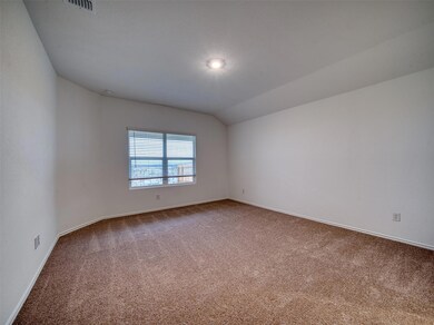 Empty room featuring baseboards and carpet