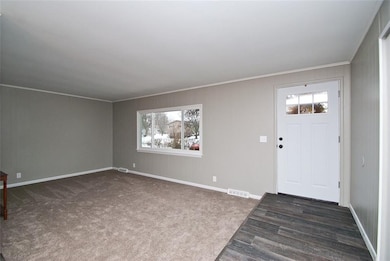 Living room from the dining room. New windows and 