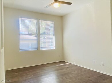 Spare room featuring dark wood-type flooring and c