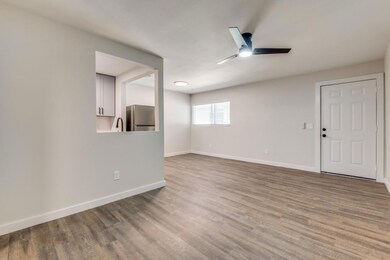 Spare room featuring wood-type flooring, ceiling f