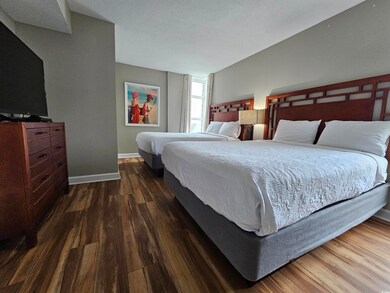Bedroom featuring dark hardwood / wood-style floor