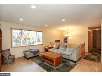 The living room offers a large picture window and 