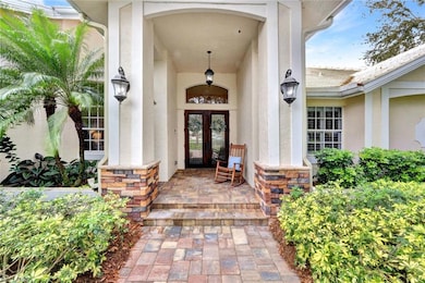 Property entrance featuring french doors and a por