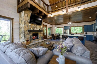 Living room featuring wooden ceiling, dark wood-ty