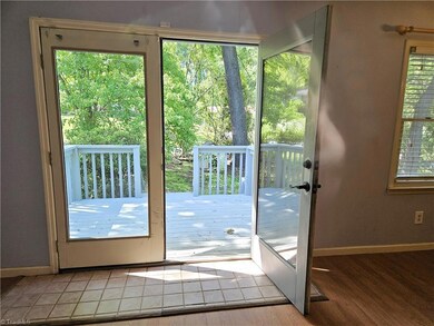 Door to 2-Tiered Deck and Fenced Backyard