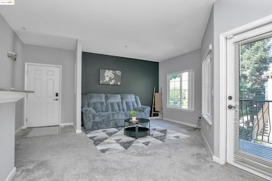 Living room featuring light carpet and baseboards