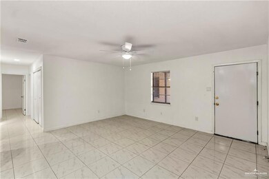 Spare room with ceiling fan