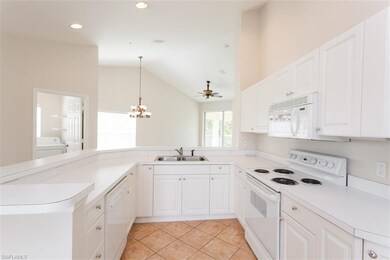 Kitchen with View of Dinning Area and Family Great Room with Vaulted Ceilings and tons of natural light