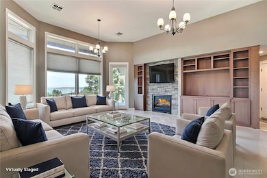 Behind the entry wall you will find this spacious family room with large windows, gorgeous fireplace and quality built-ins. Door leads to balcony porch, come in and relax! ***Virtually Staged***