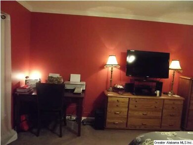 Another room in the master offset office and recli