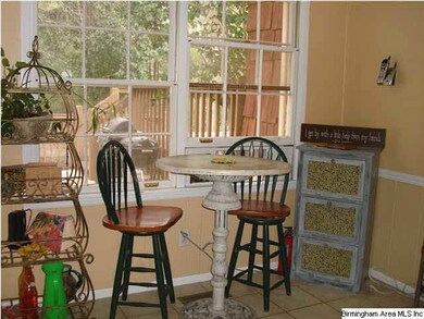 Eating area overlooks the nature lover's backyard.