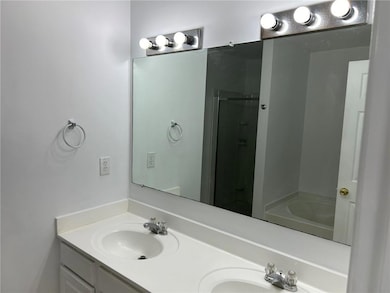 Bathroom with vanity and shower with separate bath