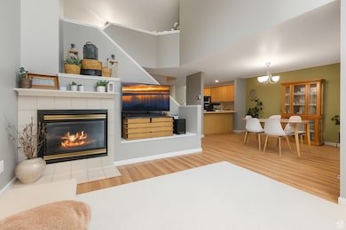 Great room feel, with a fireplace and vaulted ceilings that is open to the dining and kitchen