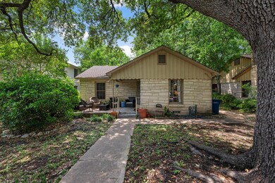 View of front of house with a patio area, stone s