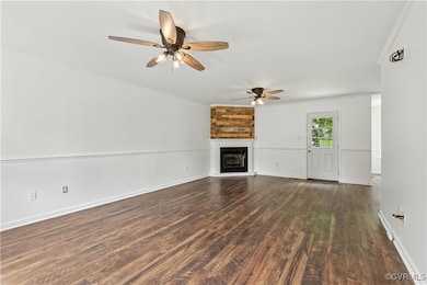 Large room featuring ceiling fan, ornamental moldi