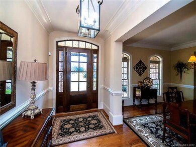 Inviting front entry door and foyer.  This home ha