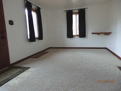 Living Room. New neutral carpet installed in the L