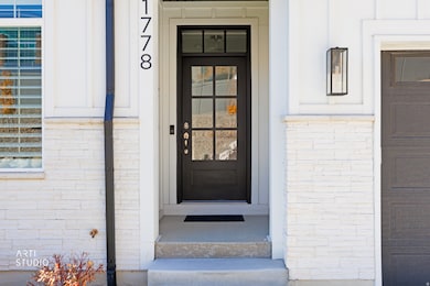 Entrance to property with brick siding