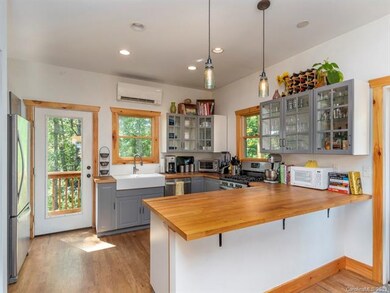 Modern kitchen with farm house sink and breakfast 