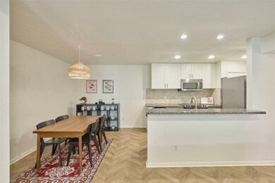 The kitchen and dining area are open to the living