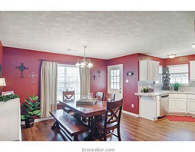 Dining Room. A large window facing the backyard fills this space with warm natural light.