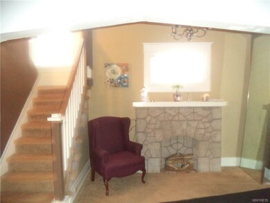 AS YOU WALK IN THRU THE ENCLOSED FRONT PORCH YOU A