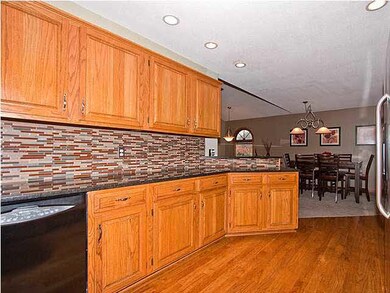 Full Wrap Kitchen with Hardwood Flooring