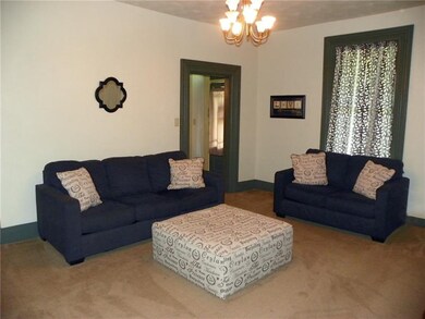 Another angle of the living room with the entry, d