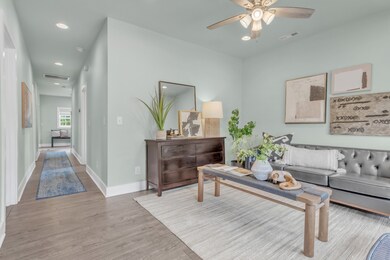 Main hallway leads to two bedrooms, kitchen and breakfast room~
