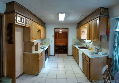 KITCHEN OPENS TO BREAKFAST NOOK AND FORMAL DINING