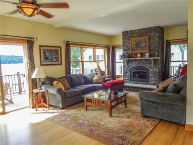 The plentiful windows in the Family Room offer lots of natural sunlight as well as gorgeous lake views... you'll love the convenient sliders that lead right out to the expansive deck...