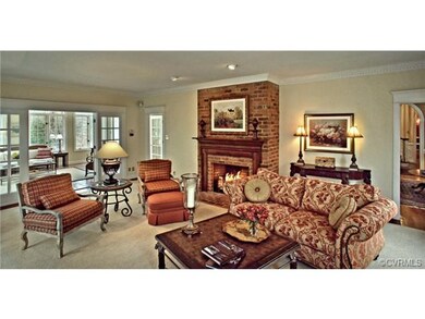 Family Room with custom area rug and fireplace flo
