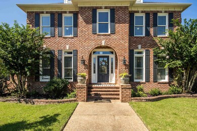 Colonial home with a front lawn