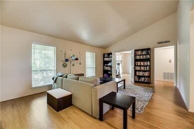 Large living area flows into the 3rd bedroom, with