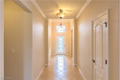 Beautiful entryway with leaded glass front door, t