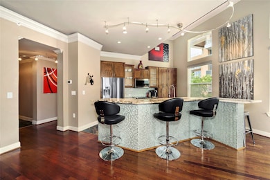 Living room seamlessly opens up to the breakfast b