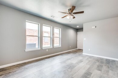 Unfurnished room with ceiling fan and light wood-t