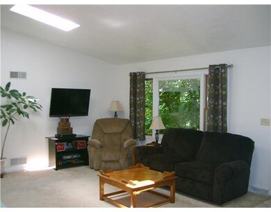Living room with open floor plan, cathedral ceilin