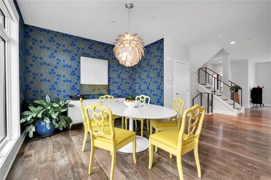 Dining nook with hand painted wallpaper.